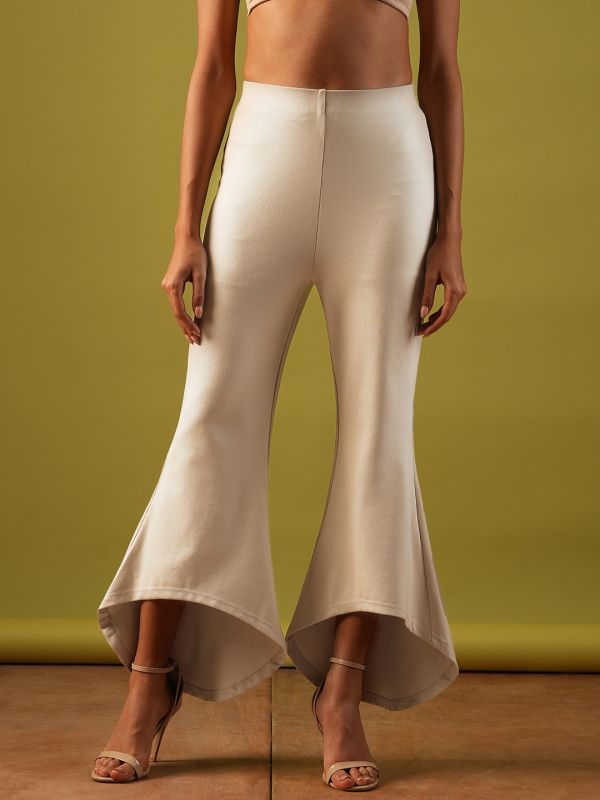 Globus Women Beige Solid Stretchable Mid-Rise High-Low Bottom Hem Flared Party Treggings