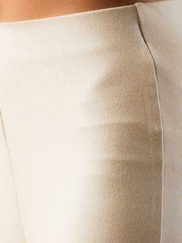 Globus Women Beige Solid Stretchable Mid-Rise High-Low Bottom Hem Flared Party Treggings