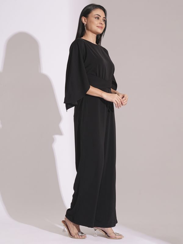 Globus Women Black Boat Neck Cape Sleeves Criss Cross Waist Tie-Up Detail Satin Party Jumpsuit